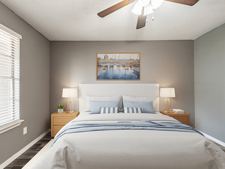 bedroom with ceiling fan, light, and window